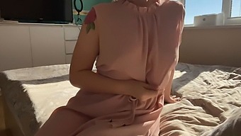 A Woman In A Delicate Pink Dress Explores Her Intimate Areas