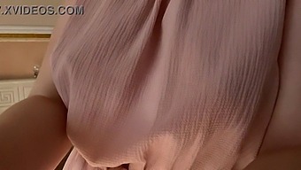 A Woman In A Delicate Pink Dress Explores Her Intimate Areas